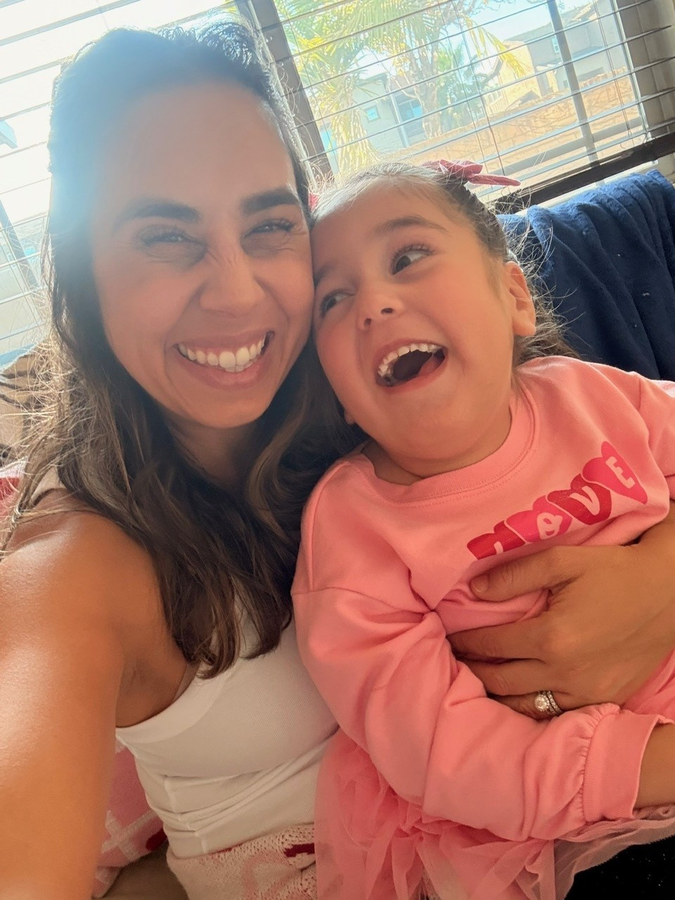 Brynlee Bonilla smiles at her mom.