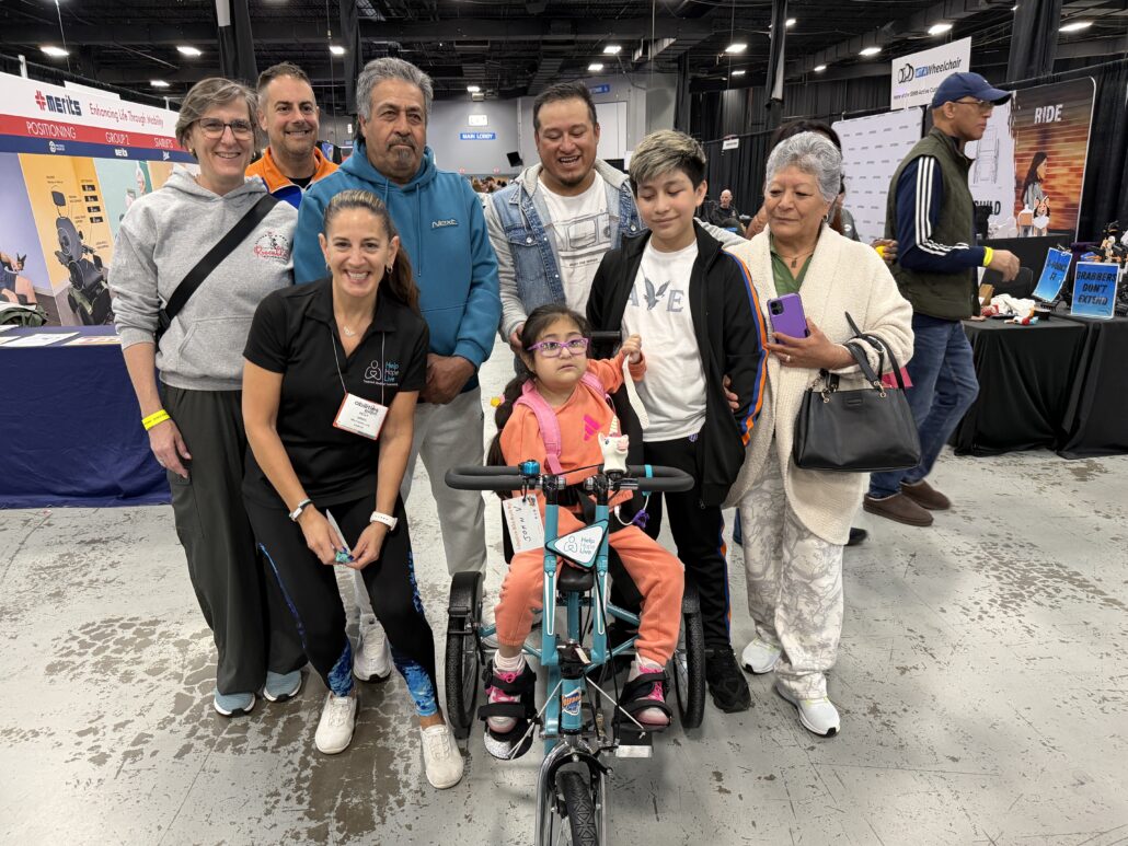 Adaptive bike recipient Jeanney and family with Kelly L Green, Freedom Concepts, and the Rosenblatt Foundation at Abilities Expo NY 2026.