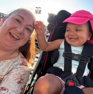 Kaylee Babb with mom Melianie Babb. Kaylee sits in a wheelchair.