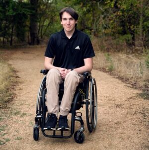 Jacob Brewer seated in his manual wheelchair.