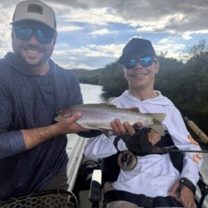 Tanner LaMagna with a photo of the cuttbow trout he caught on an adaptive fishing trip in July 2026.
