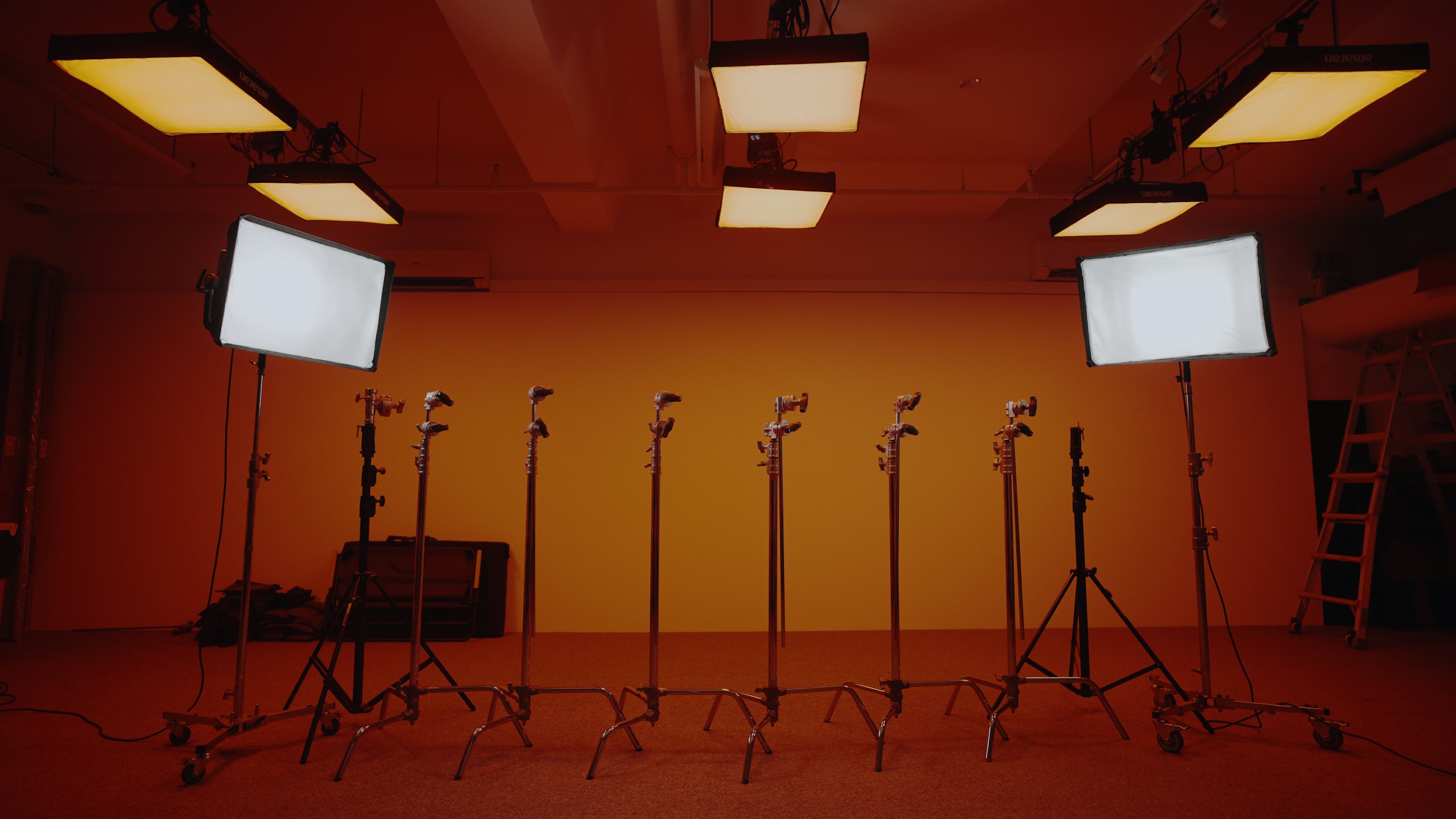 Lighting and stands in the middle of a photo studio.