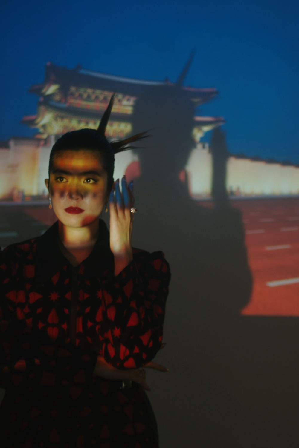 Woman standing in front of a projector.