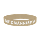 Armband - Silikon - Medmänniska - Beige, en produkt från Nya Musik som utvecklar och engagerar människor i alla åldrar.