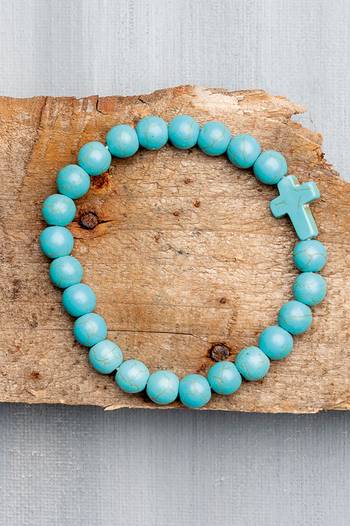 Armband kula, kors – Turkos, en produkt från Nya Musik som utvecklar och engagerar människor i alla åldrar.