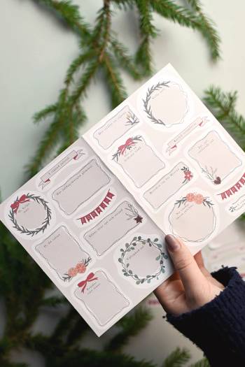 Klistermärkesark - Ettiketter med strofer från julsånger, en produkt från Nya Musik som utvecklar och engagerar människor i alla åldrar.