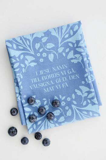 Kökshandduk - I Jesu namn till bords vi gå, en produkt från Nya Musik som utvecklar och engagerar människor i alla åldrar.