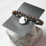 Armband - Träpärlor - Lean on me, en produkt från Nya Musik som utvecklar och engagerar människor i alla åldrar.