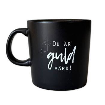 Mugg – Svart, du är guld värd, en produkt från Nya Musik som utvecklar och engagerar människor i alla åldrar.