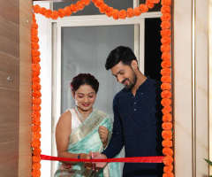 Couple walking into their new home after possession