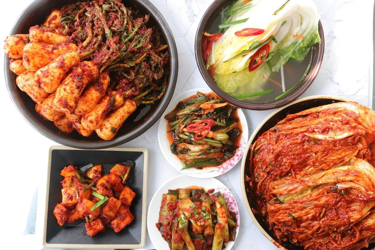 A variety of Korean kimchi served on different dishes