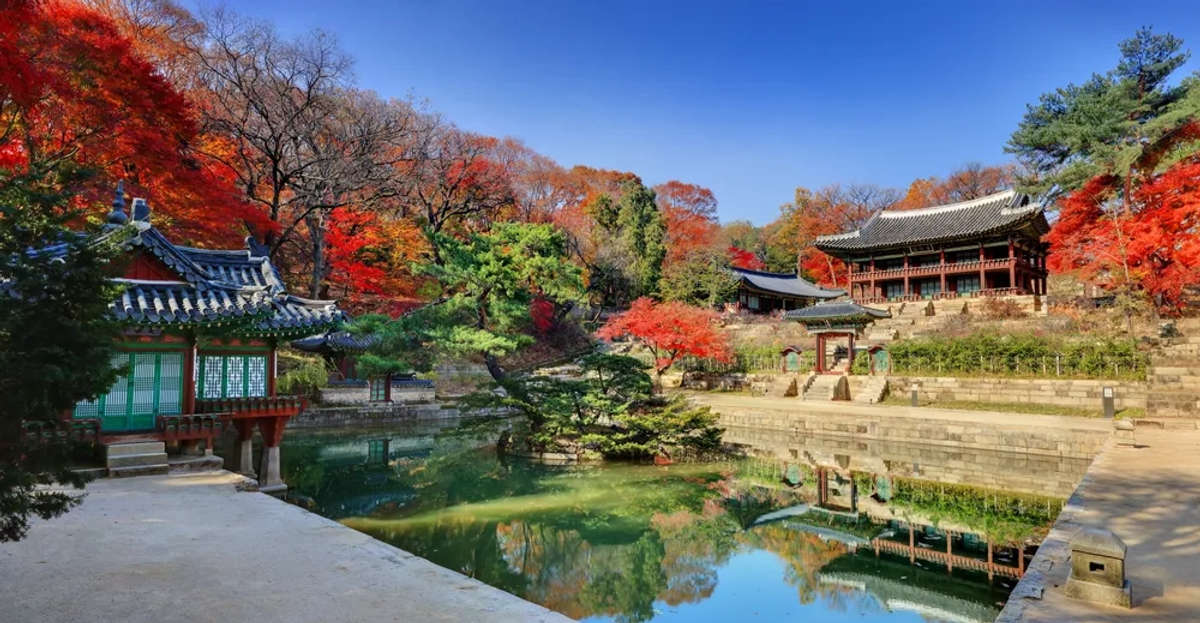 The beautiful view of Changdeokgung Palace's secret garden in autumn, featuring Buyongji and Juhapru.