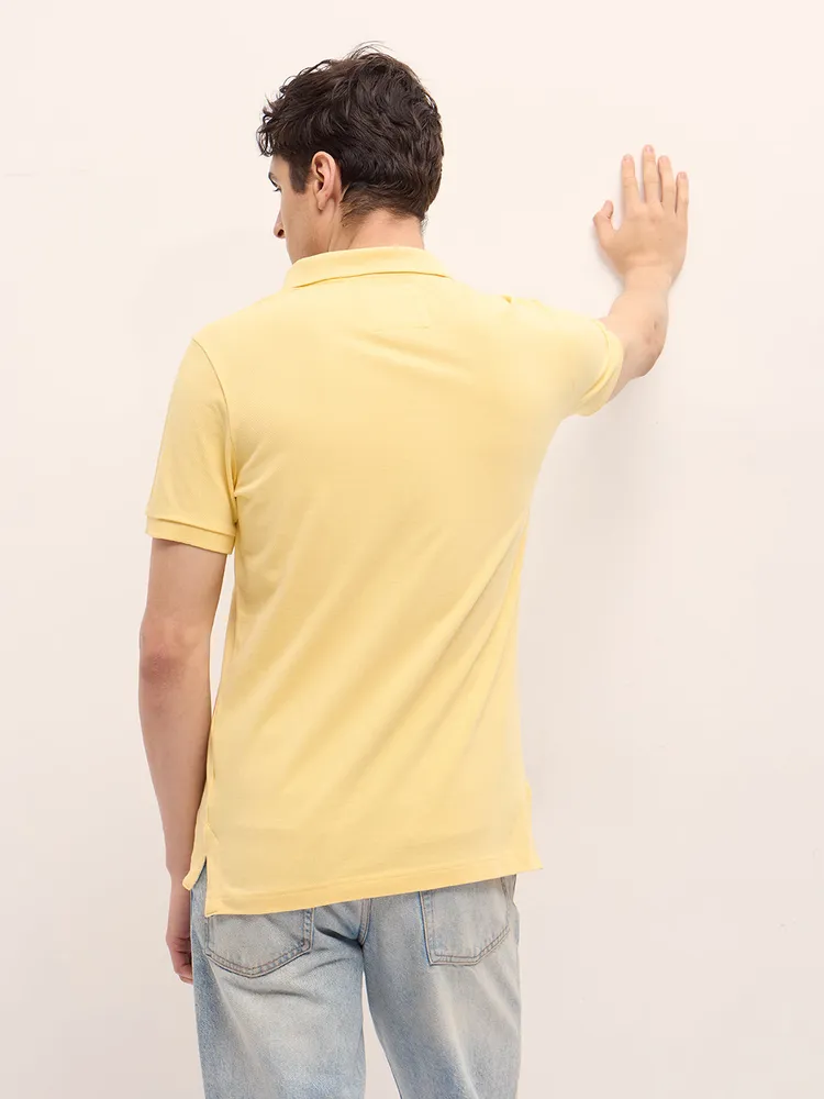 Yellow Solid Regular Fit Polo with Embroidered Chest Logo