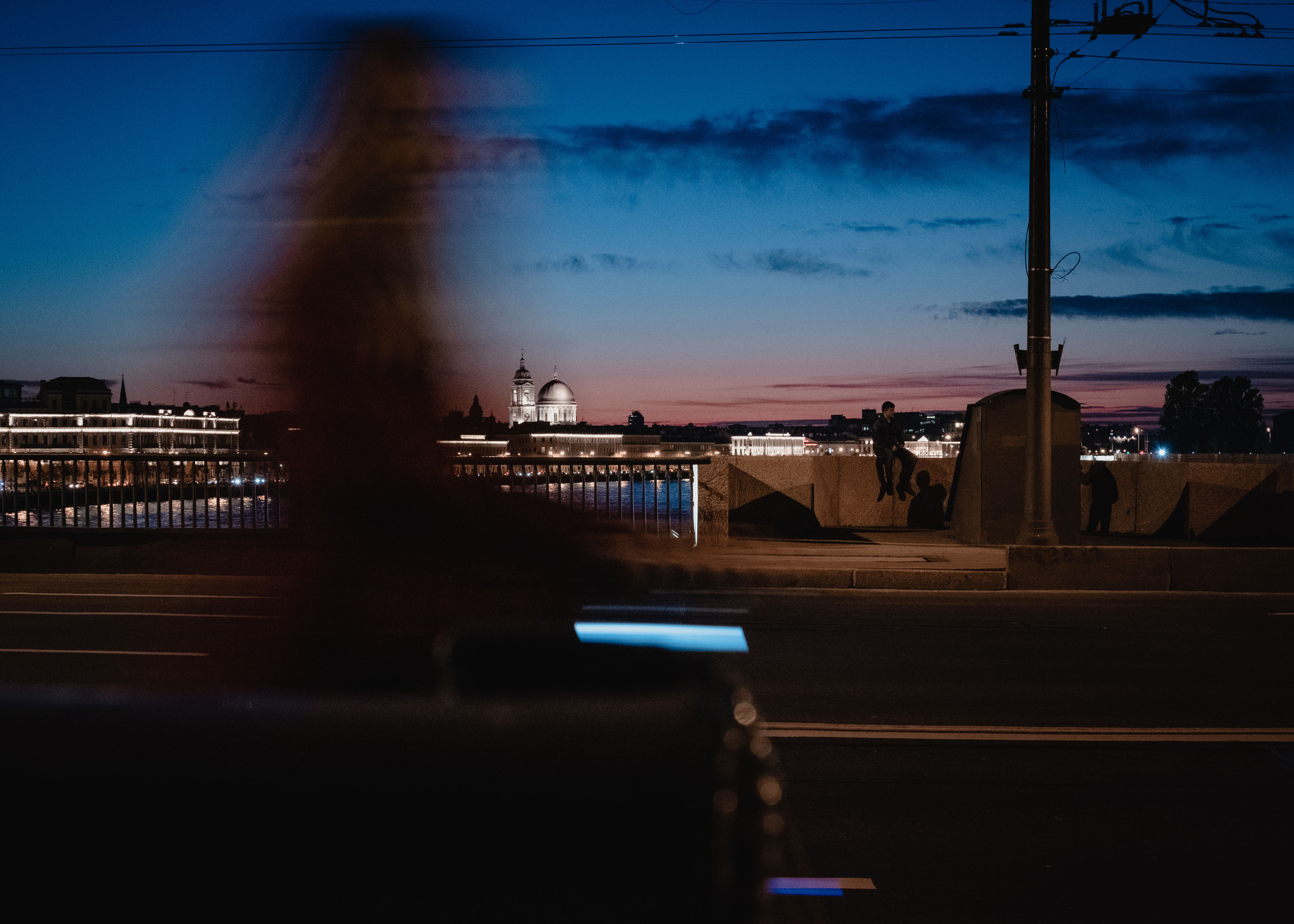 A passing girl on a bridge