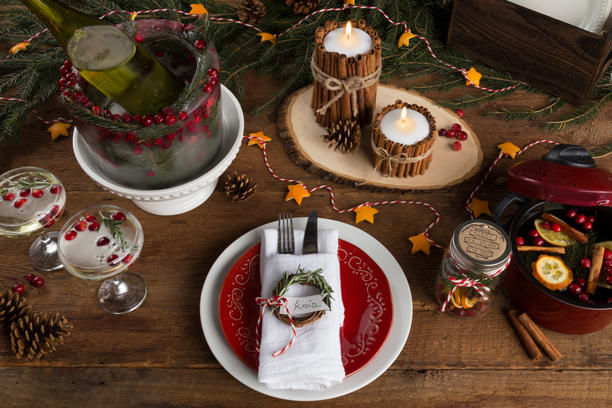 Christmas Table Setting with Wine, Candles and Drinks