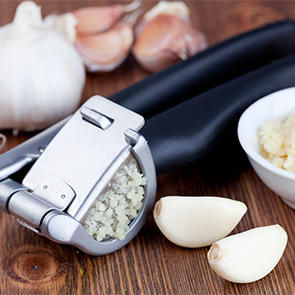 garlic cloves and garlic press