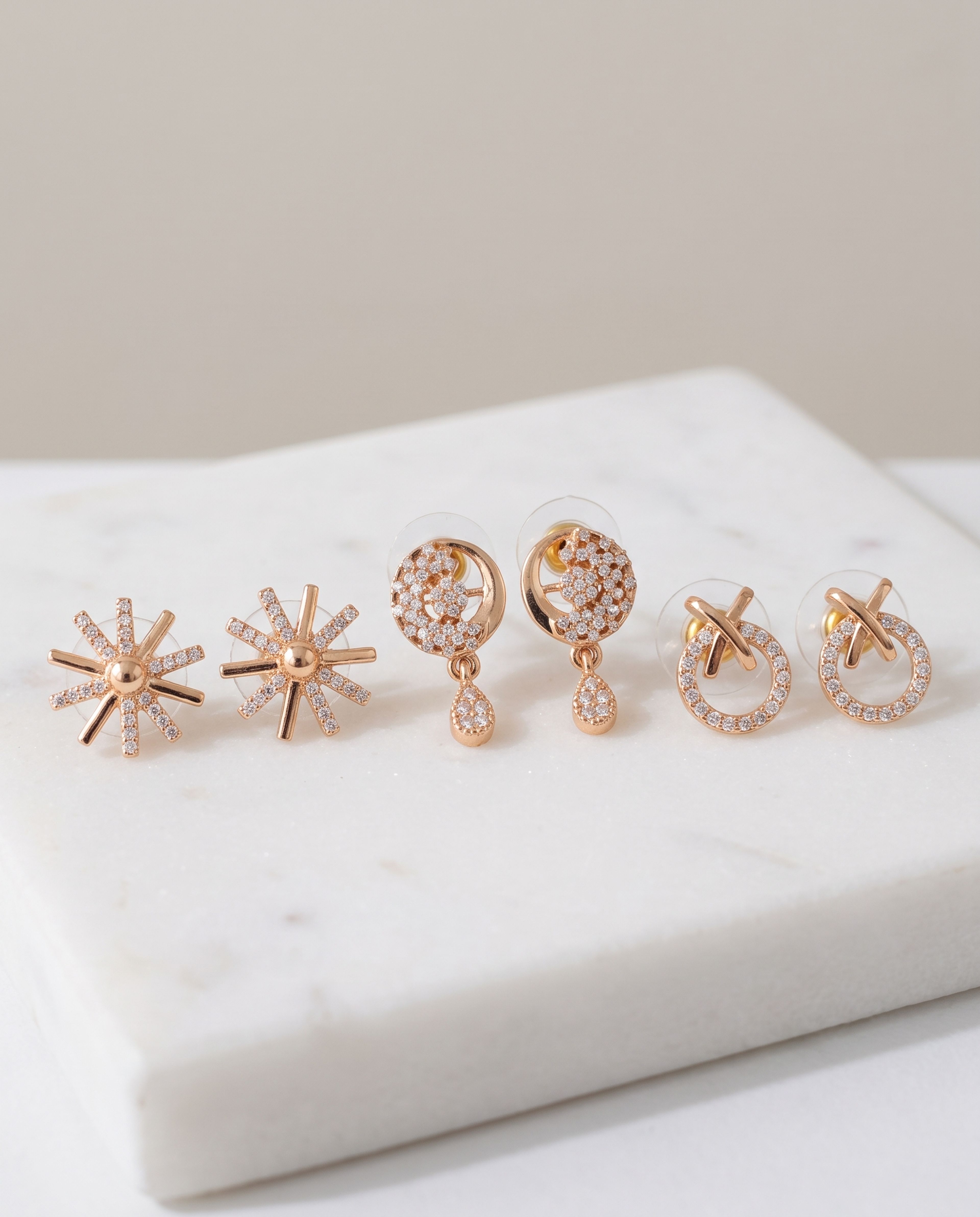3 pieces Daily Wear Earrings Combo laid on white marble