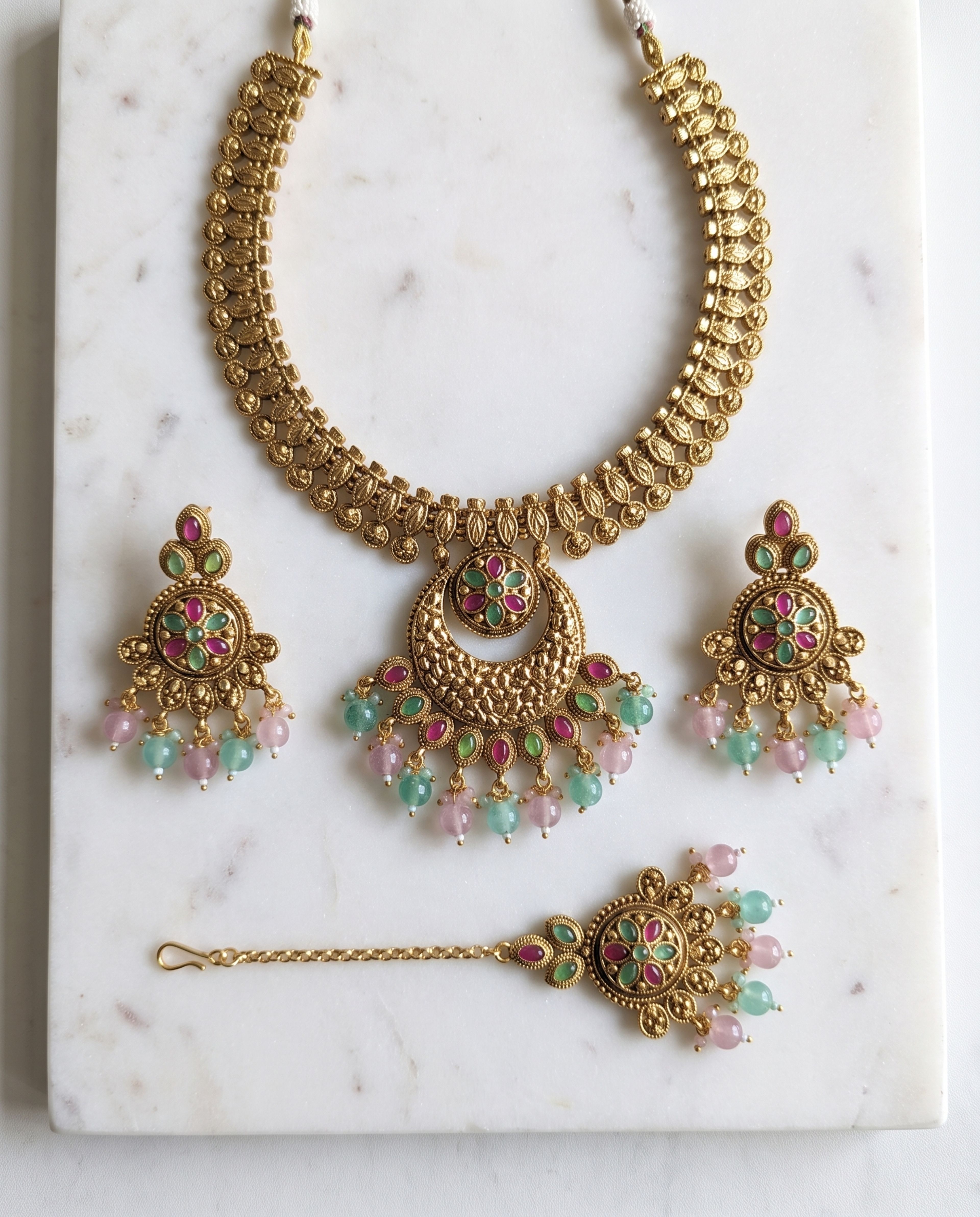 Antique Choker Set laid on white marble