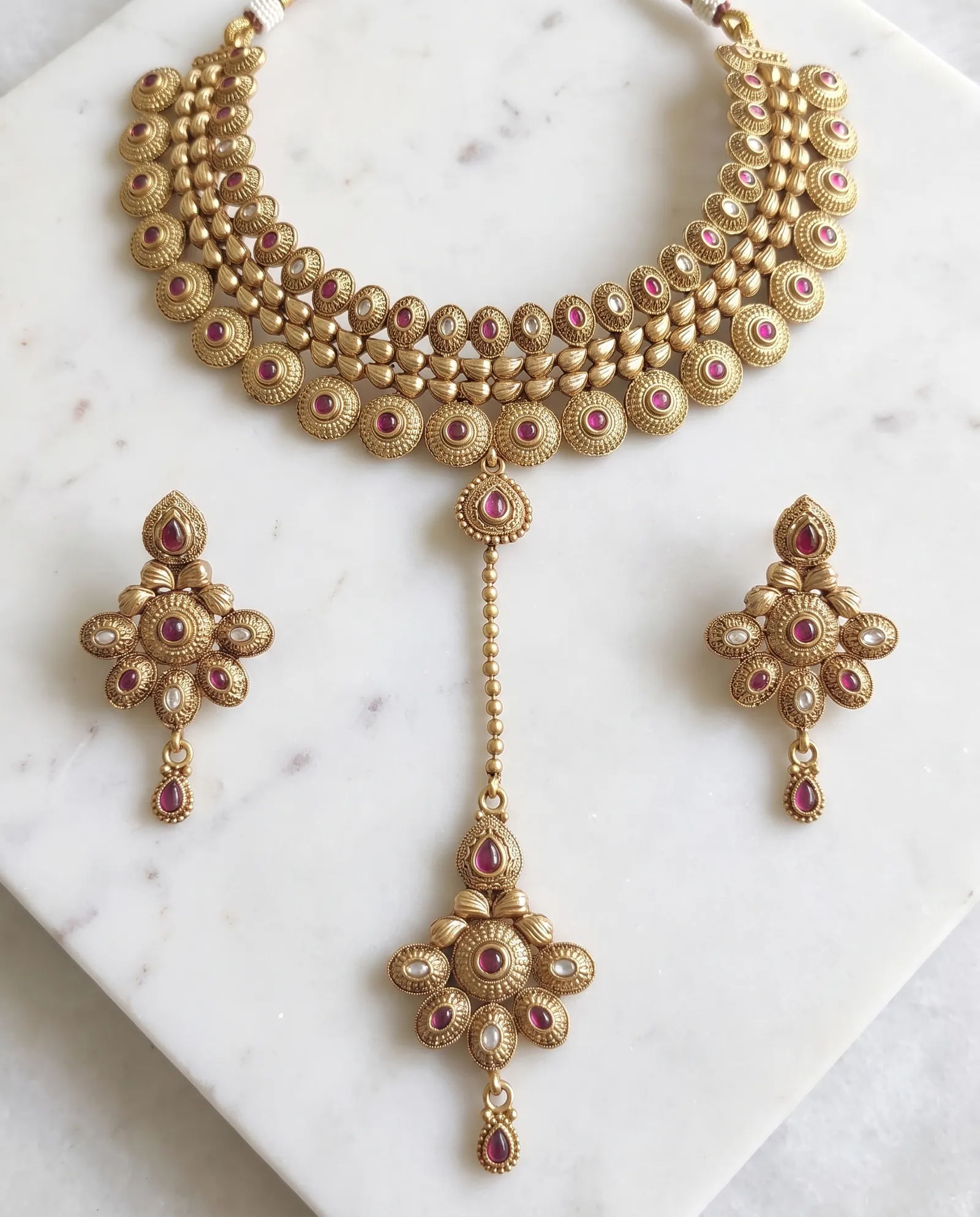 Antique Choker set laid on white marble
