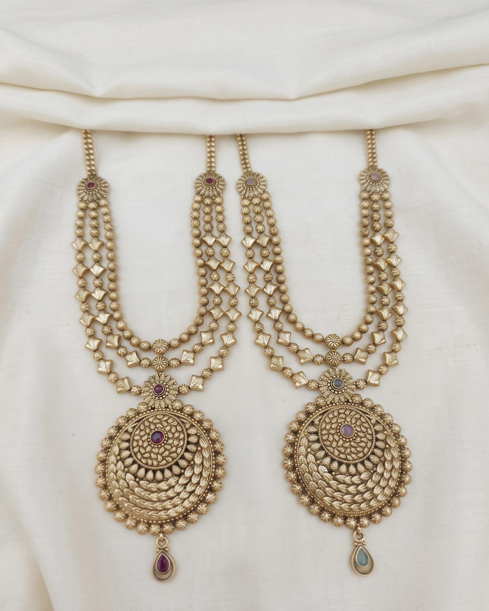 Antique Round Medallion Layered Long Necklace laid on white marble