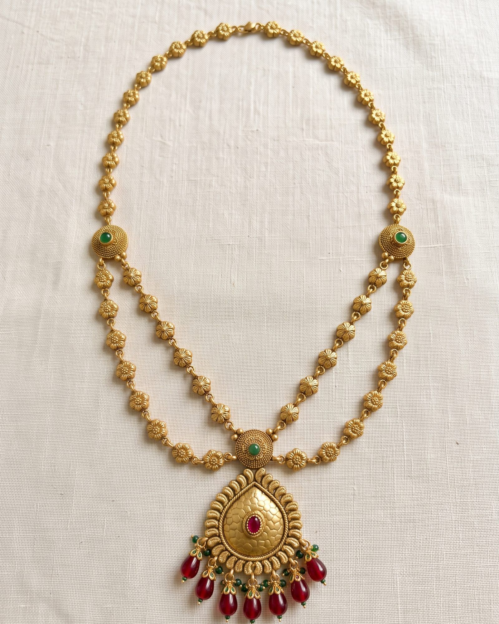 Antique Floral Layered Long Necklace laid on white marble