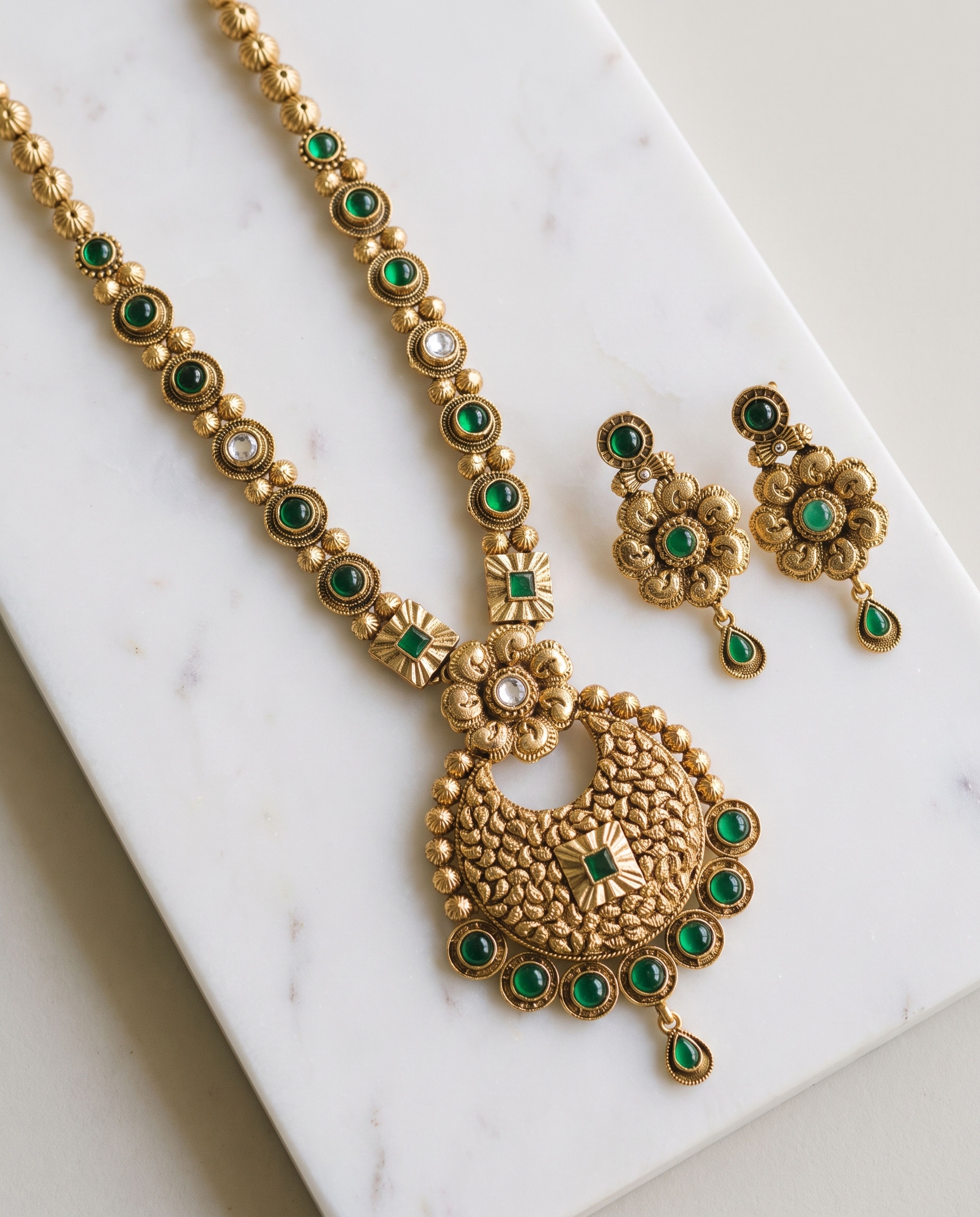 Antique Long Chain with Earring laid on white marble