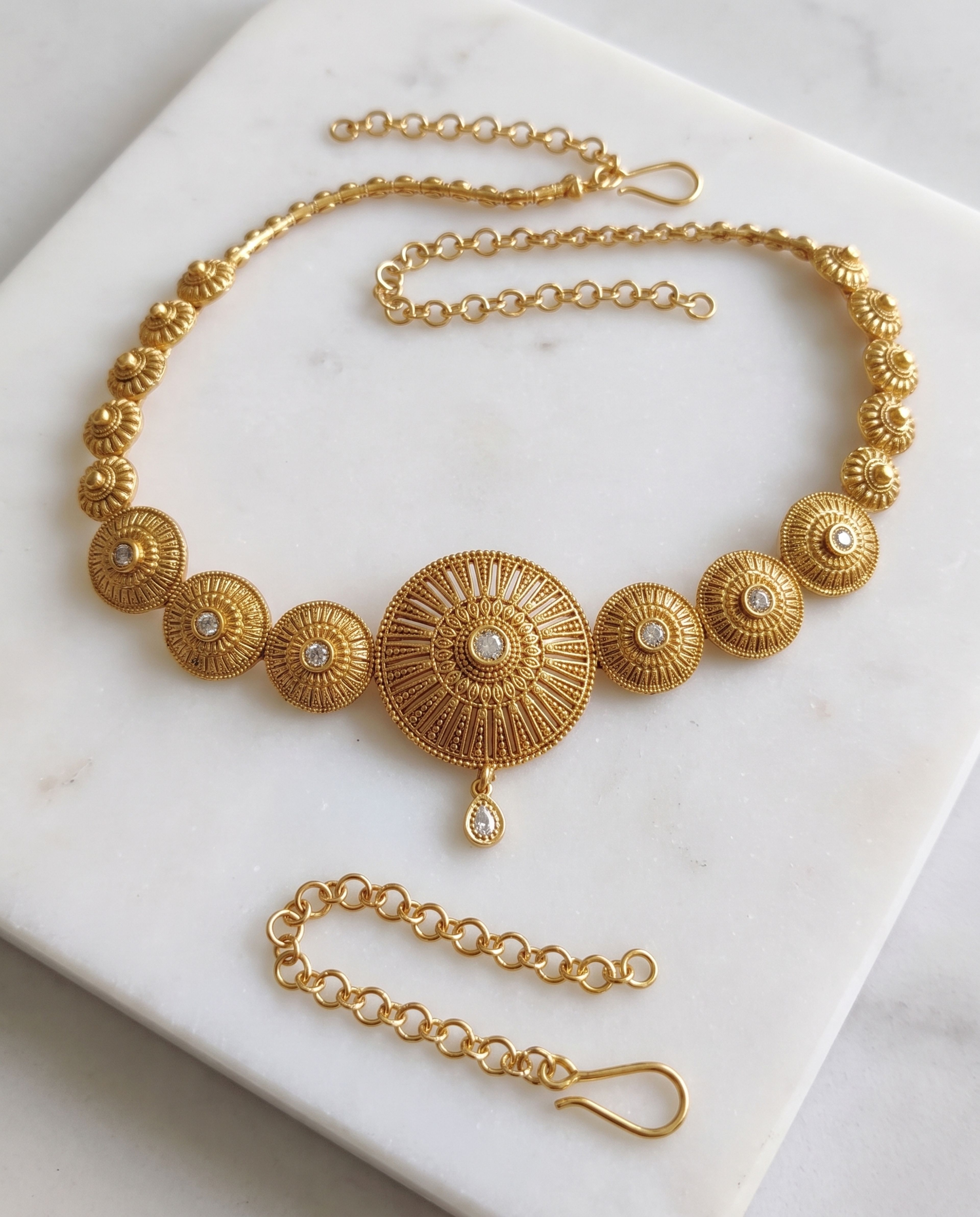 Antique Waist Chain laid on white marble
