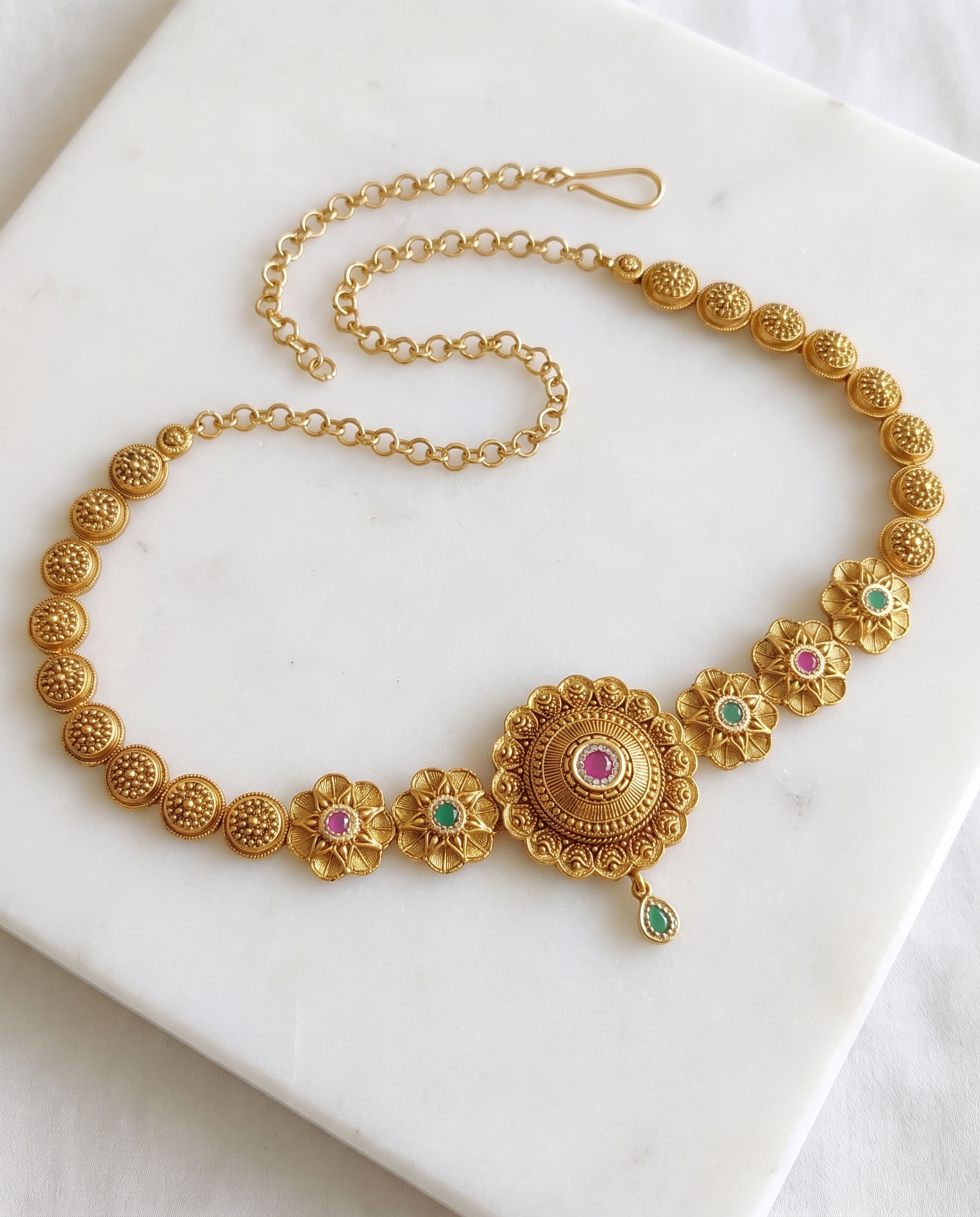 Antique Waist Chain laid on white marble