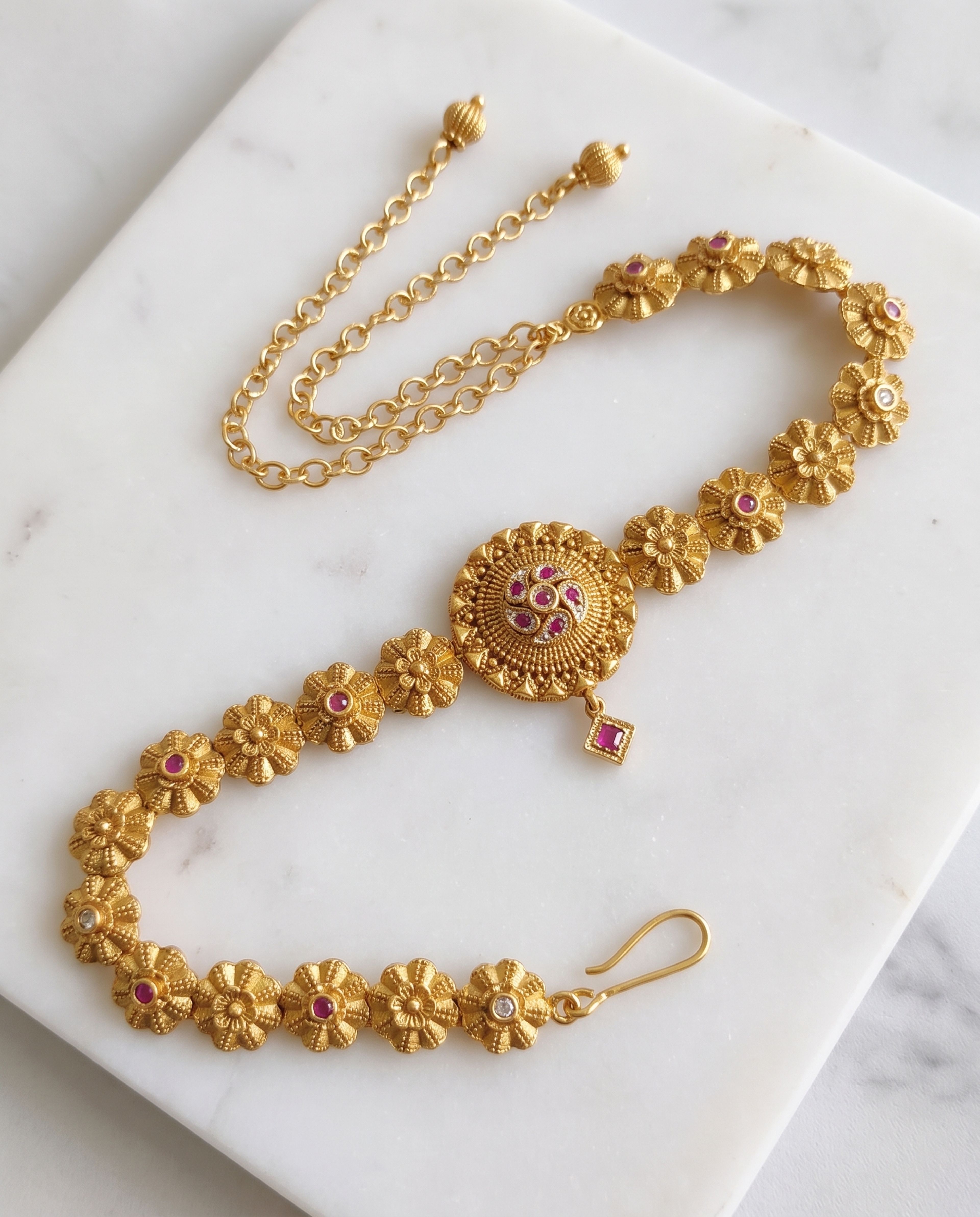 Antique Waist Chain laid on white marble