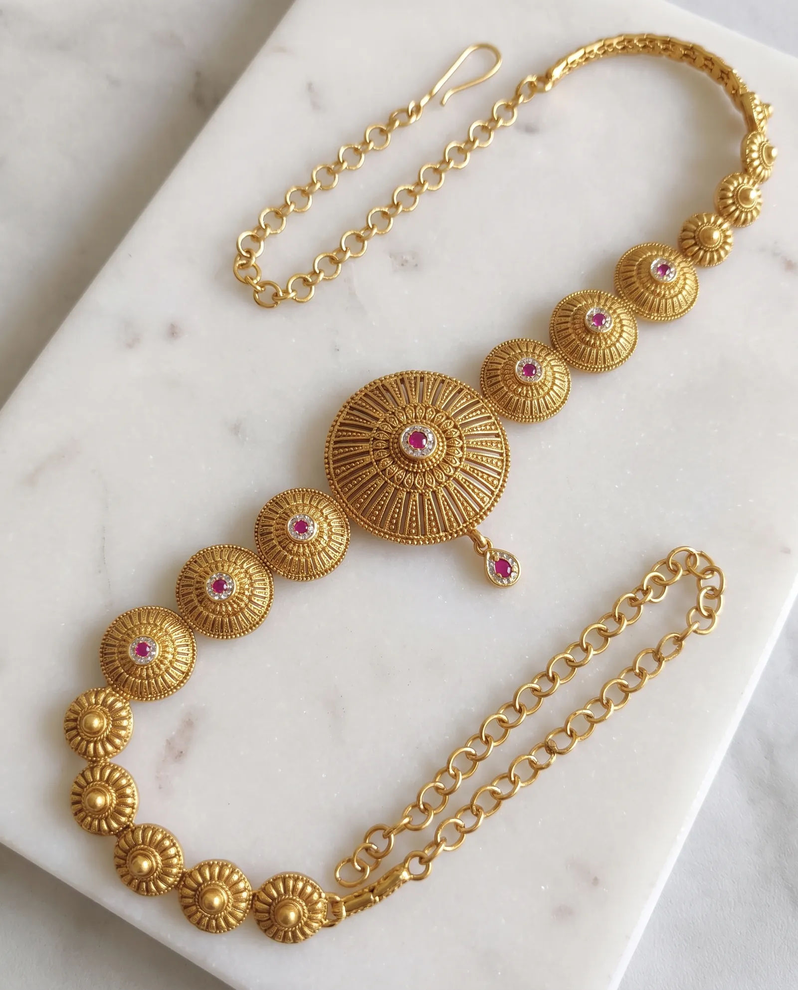 Antique Waist Chain laid on white marble