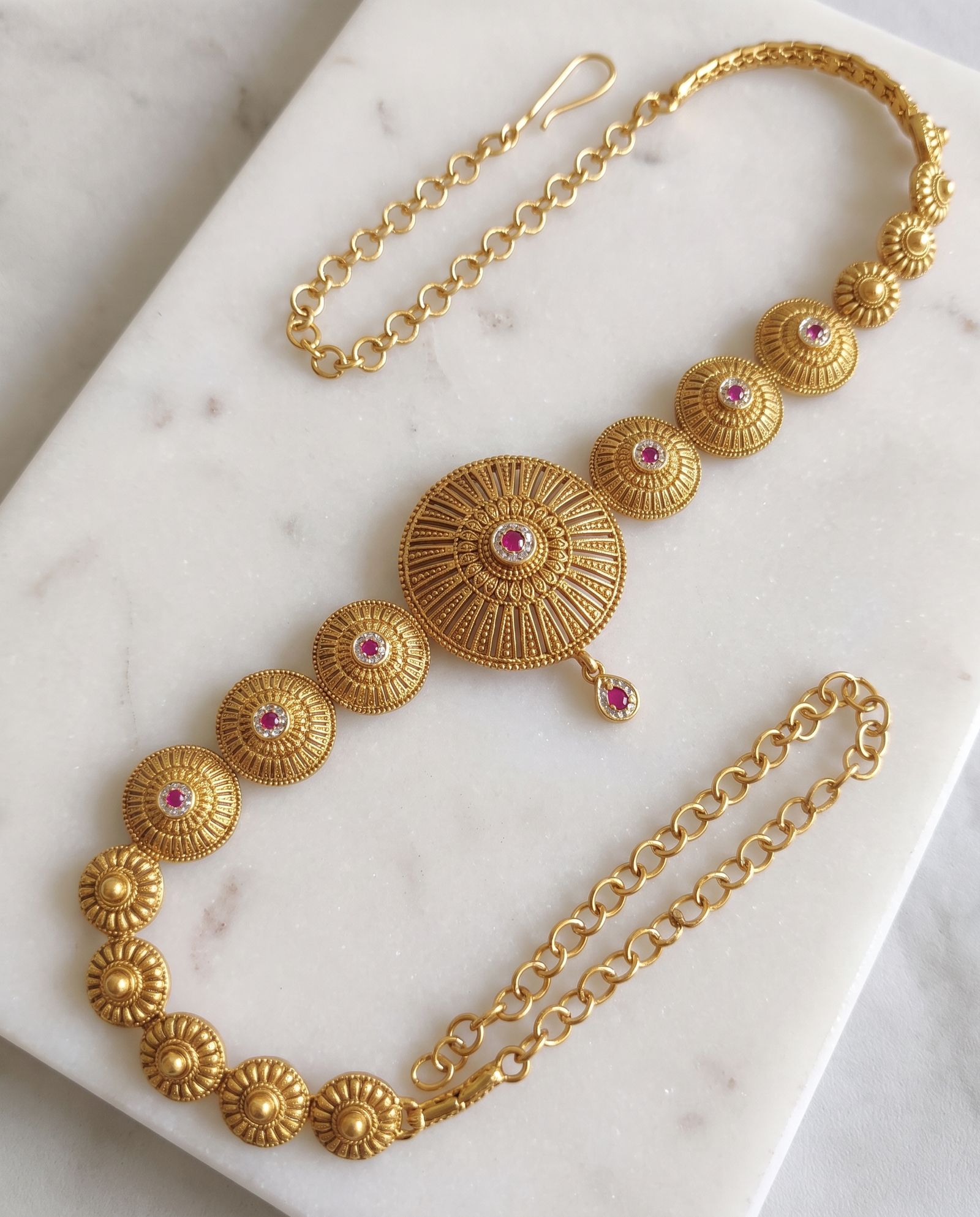 Antique Waist Chain laid on white marble