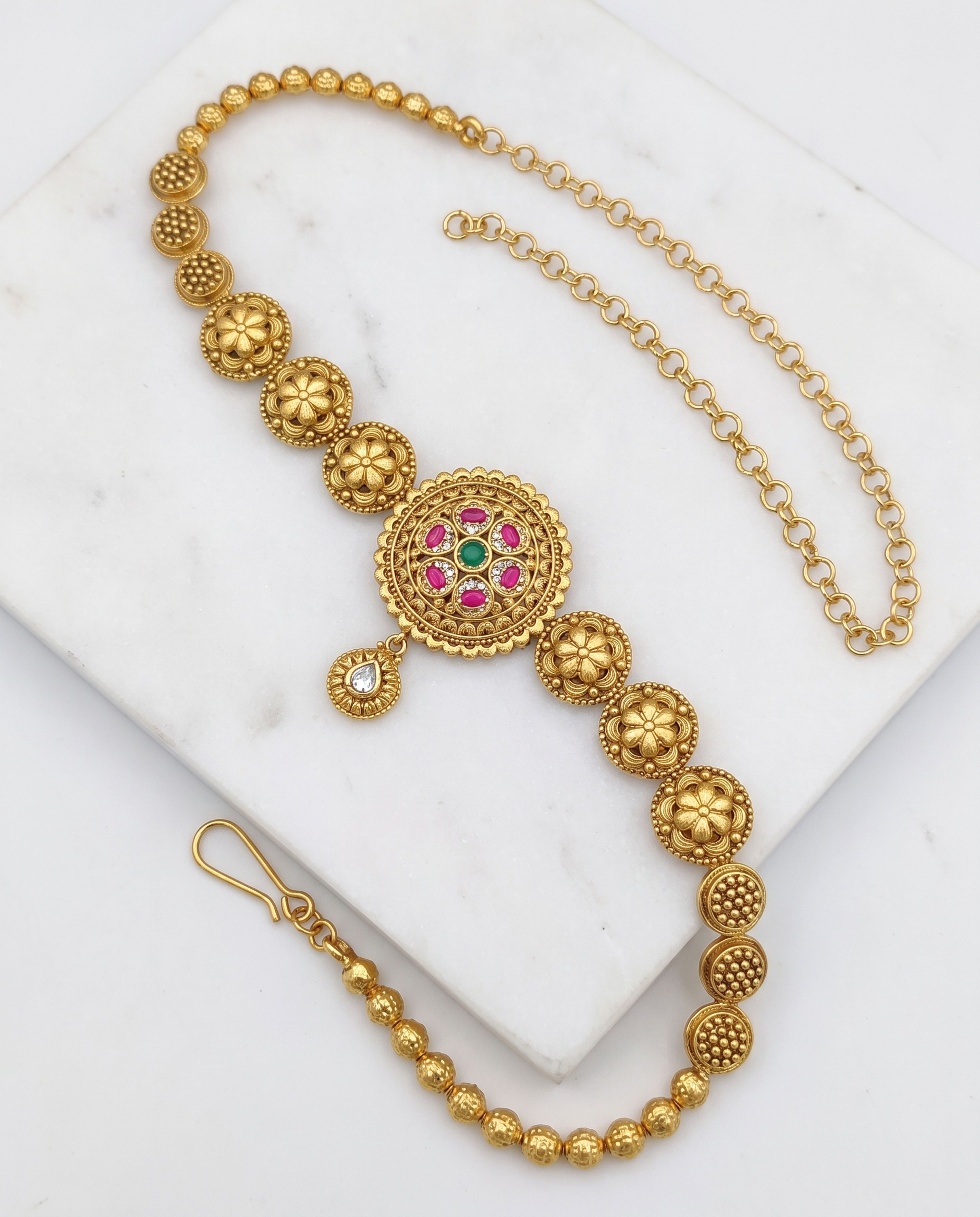 Antique Waist Chain laid on white marble