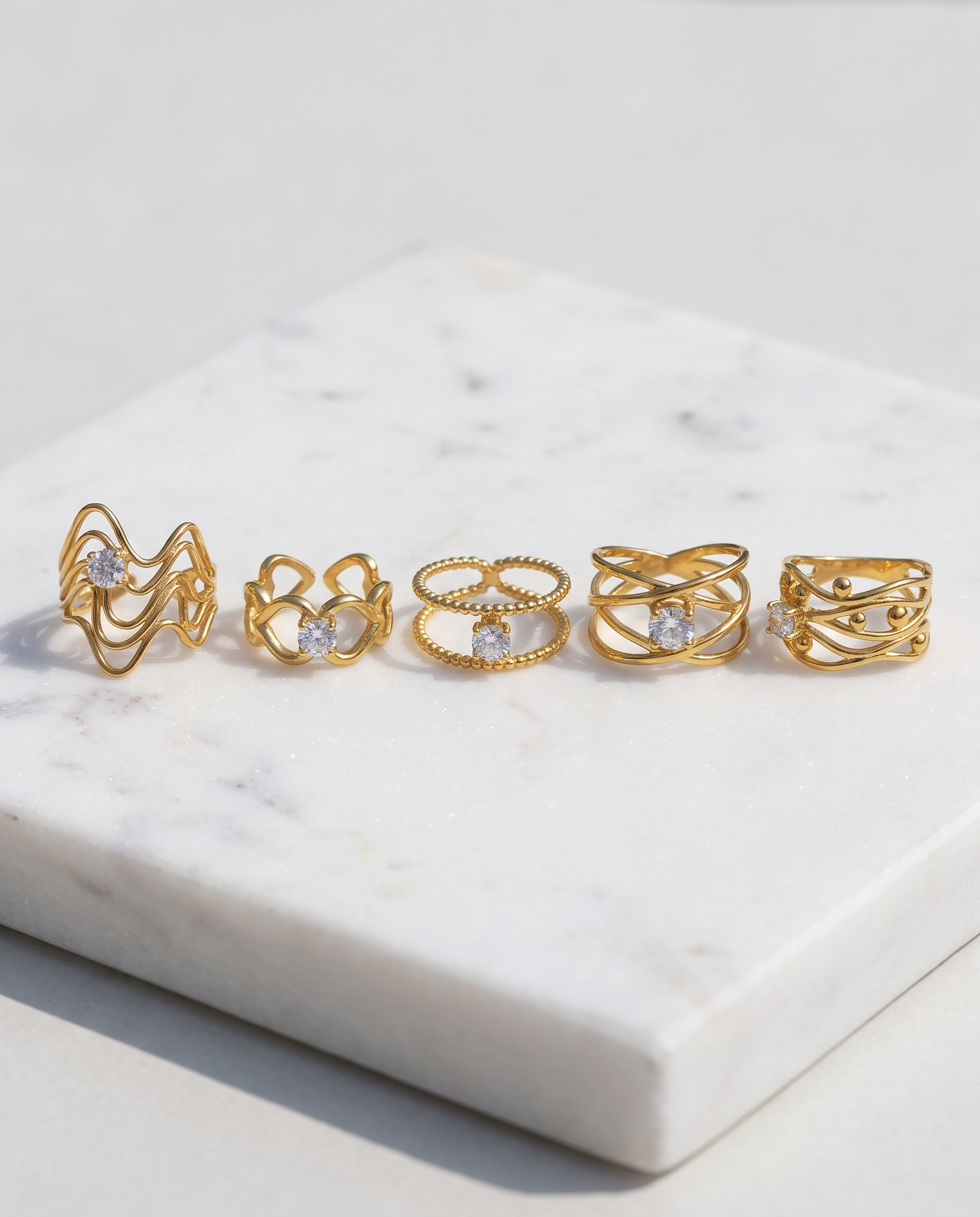 5-Piece Anti-Tarnish Openwork Ring Combo laid on white marble