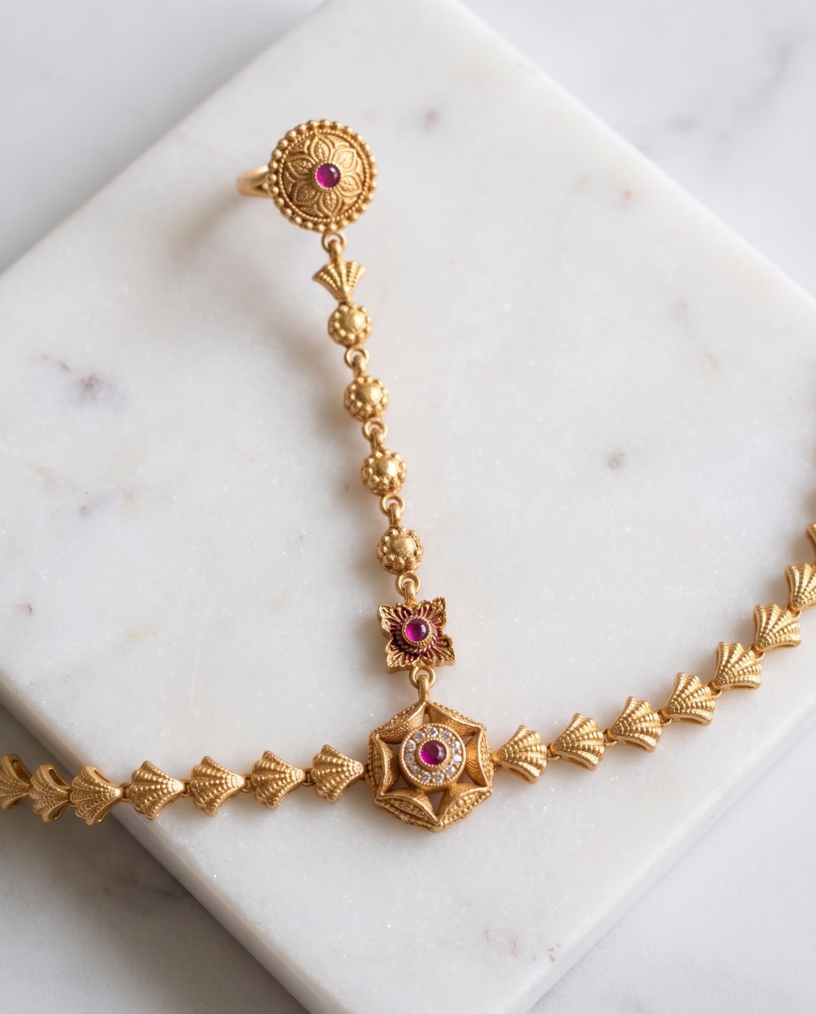 Ring Bracelet (1 piece) laid on white marble