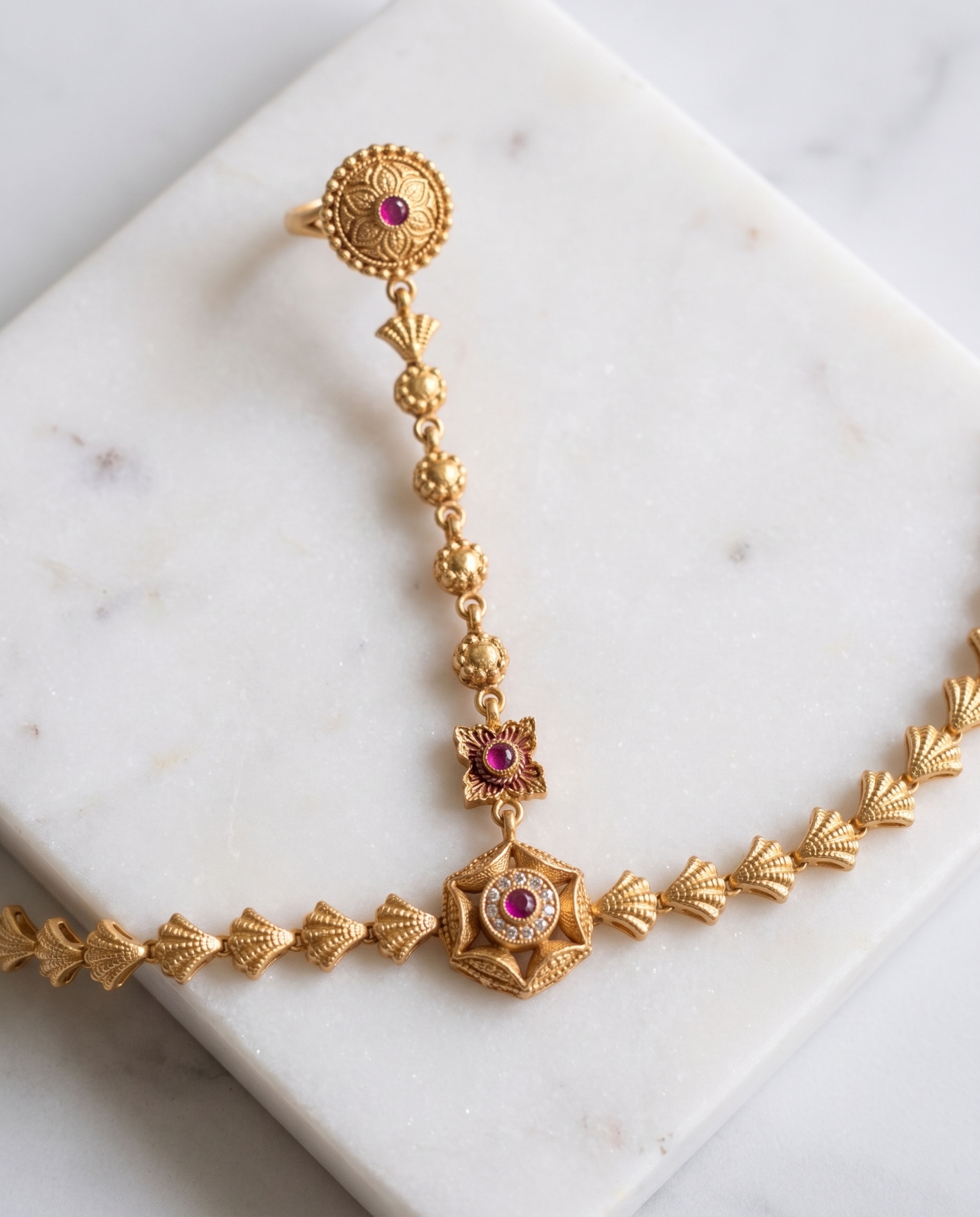 Ring Bracelet (1 piece) laid on white marble