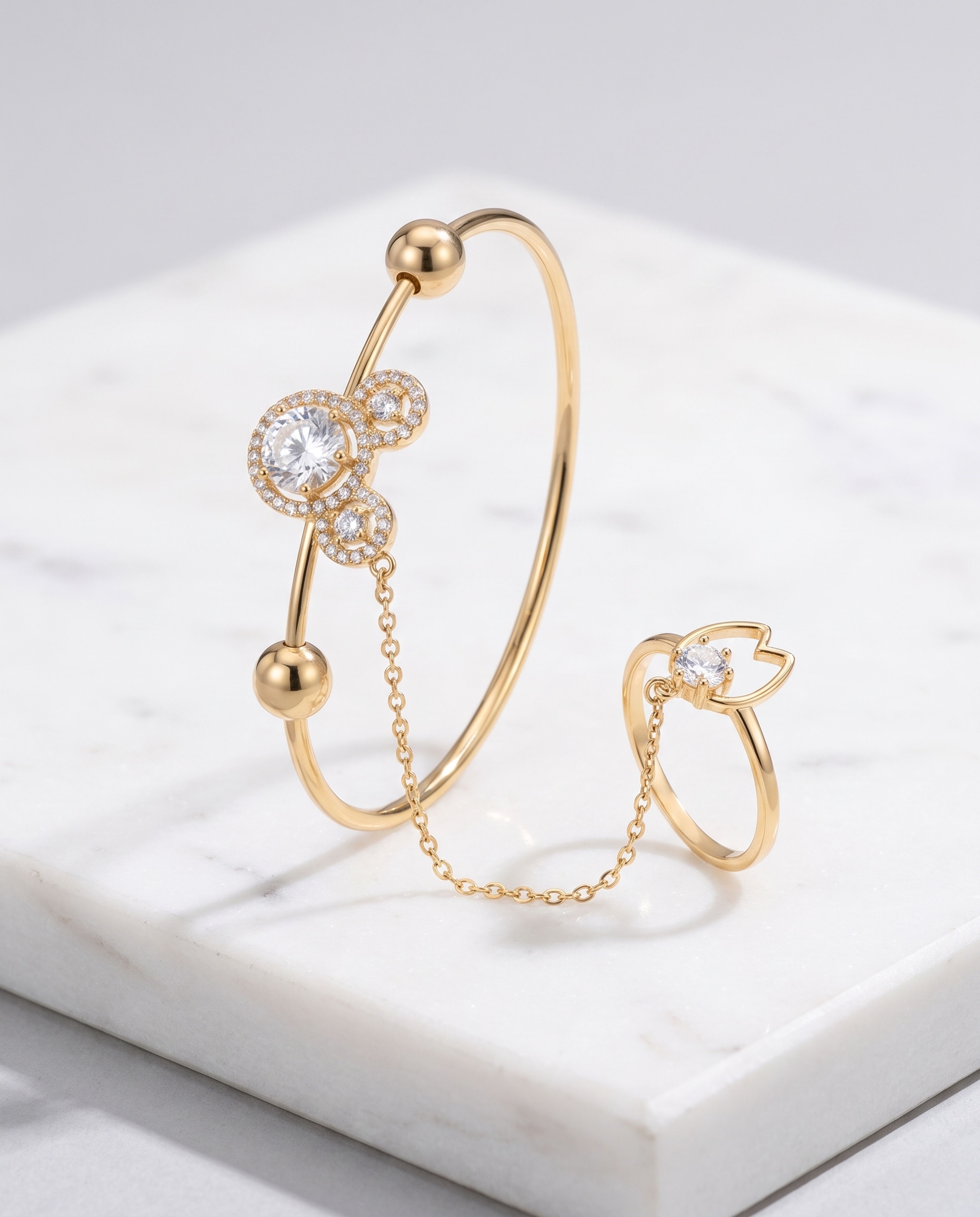 Anti-Tarnish Trefoil Hand Harness Bracelet laid on white marble