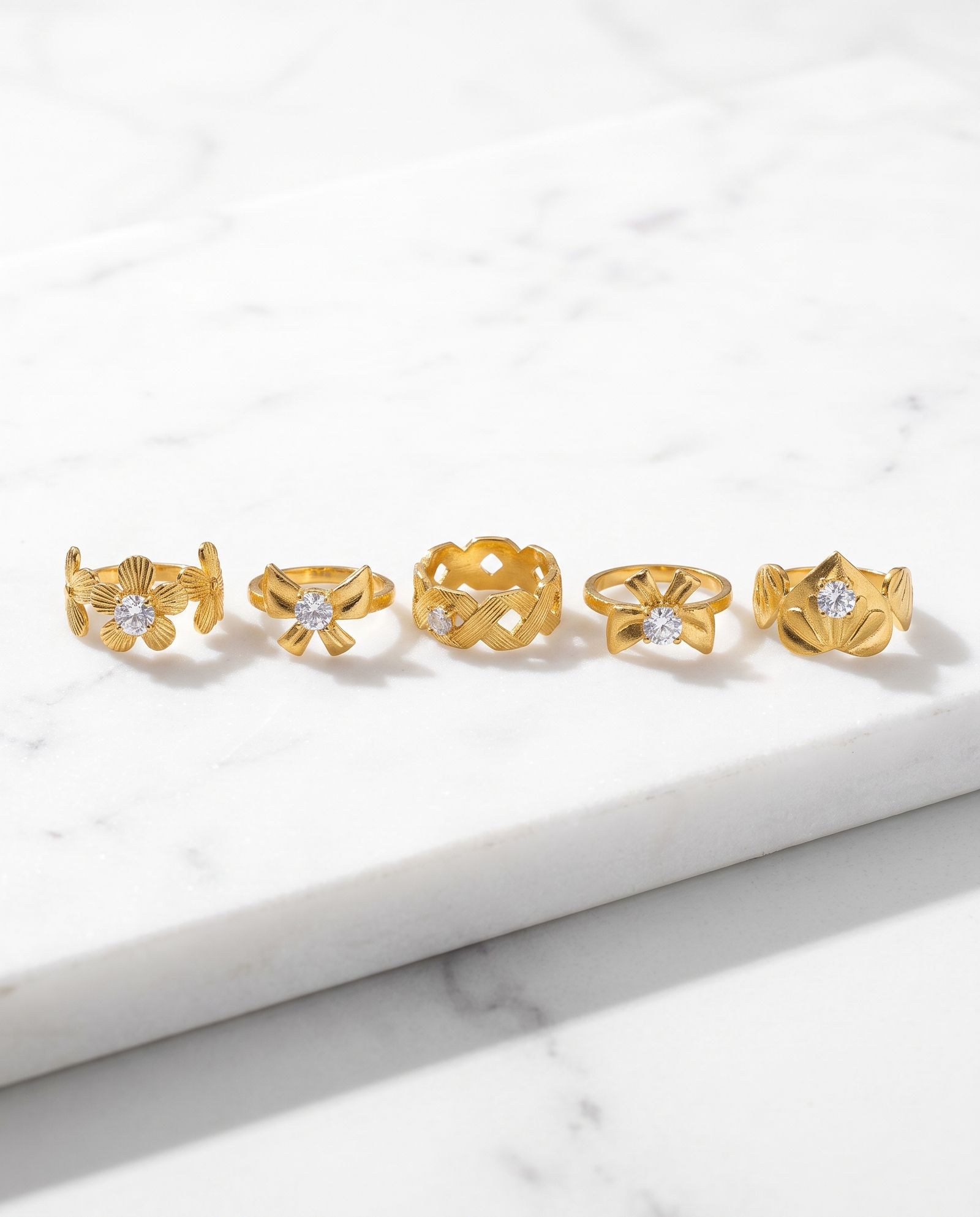 5-Piece Anti-Tarnish Floral Ring Combo laid on white marble
