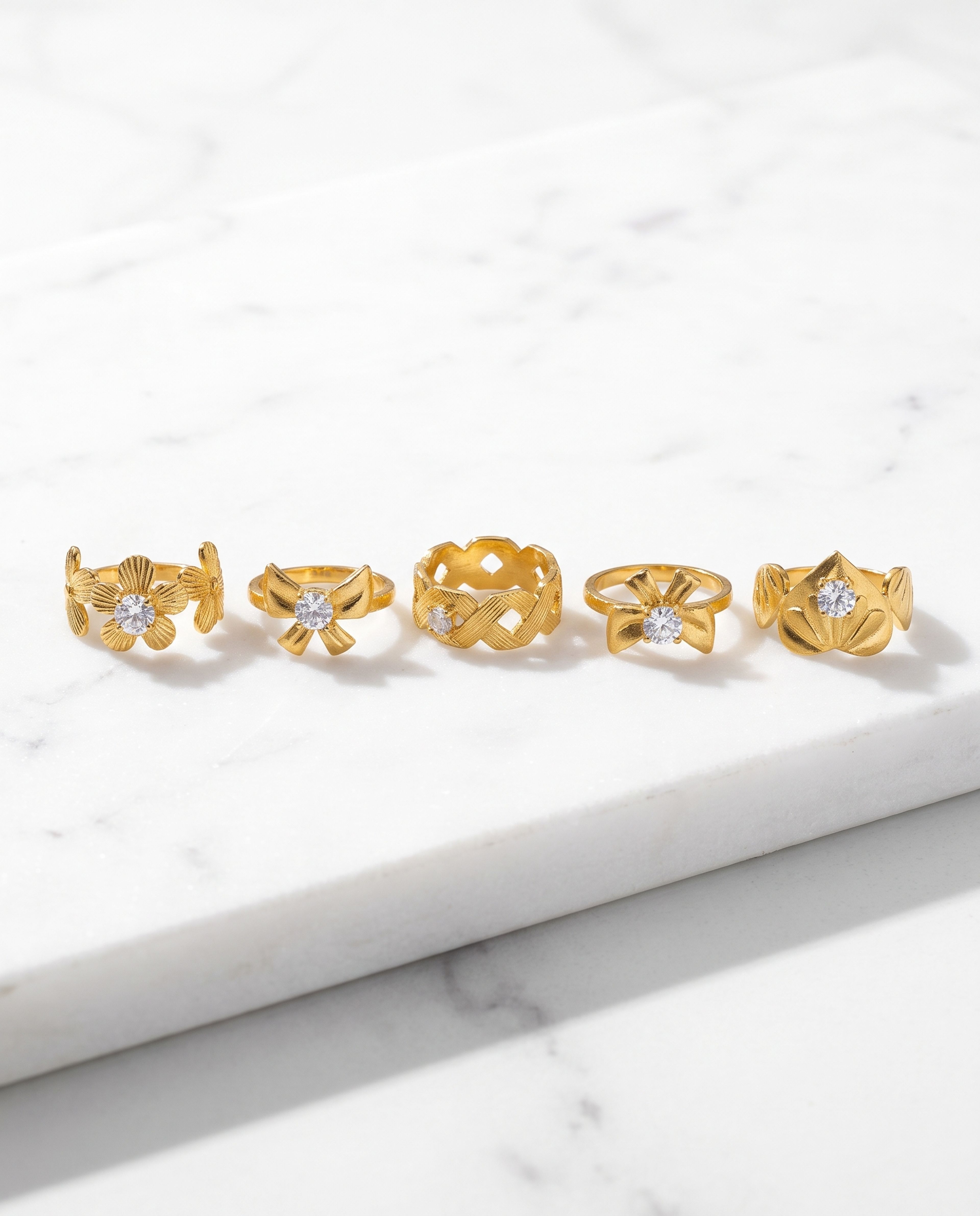 5-Piece Anti-Tarnish Floral Ring Combo laid on white marble