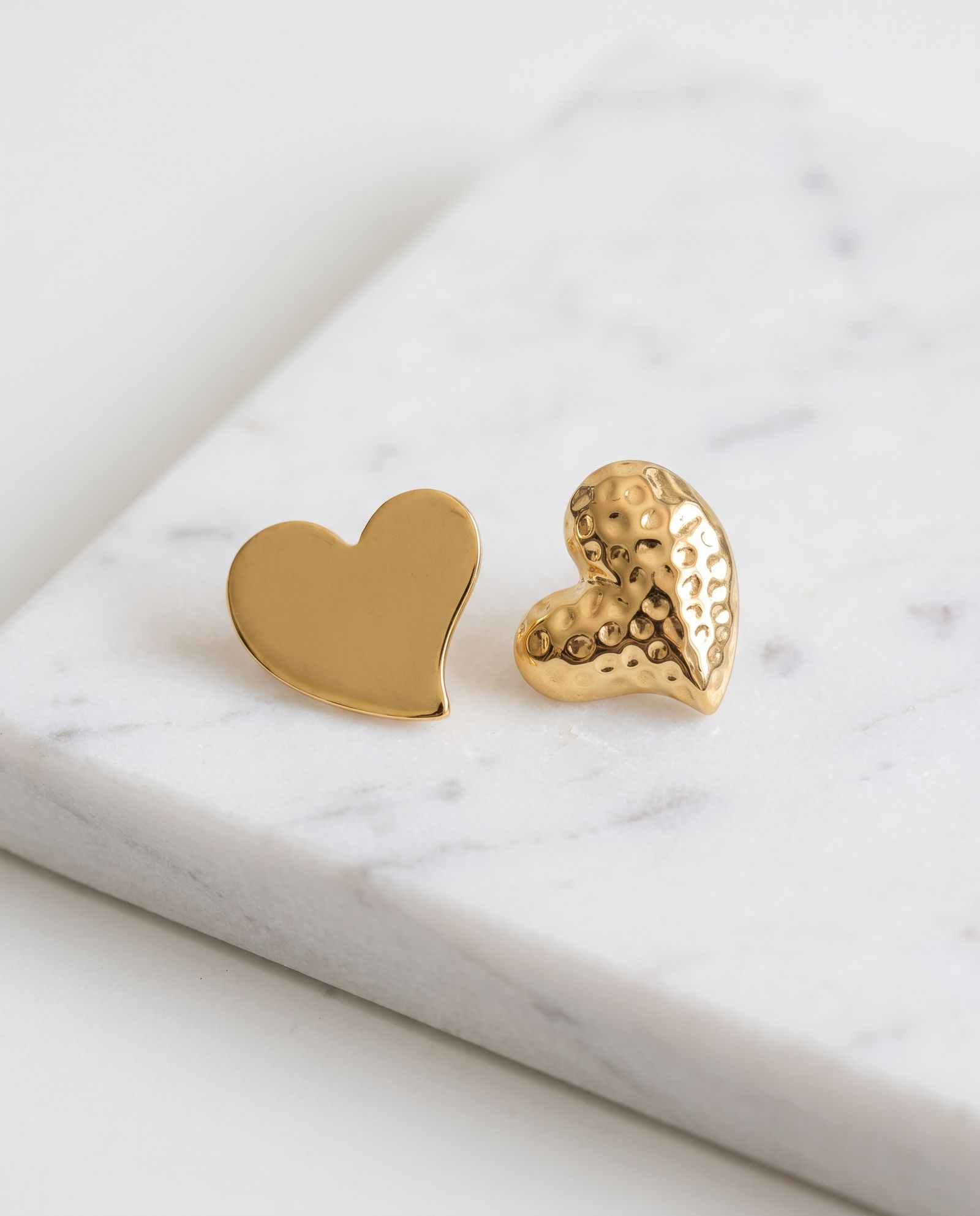 Heart Earring Anti Tarnish laid on white marble