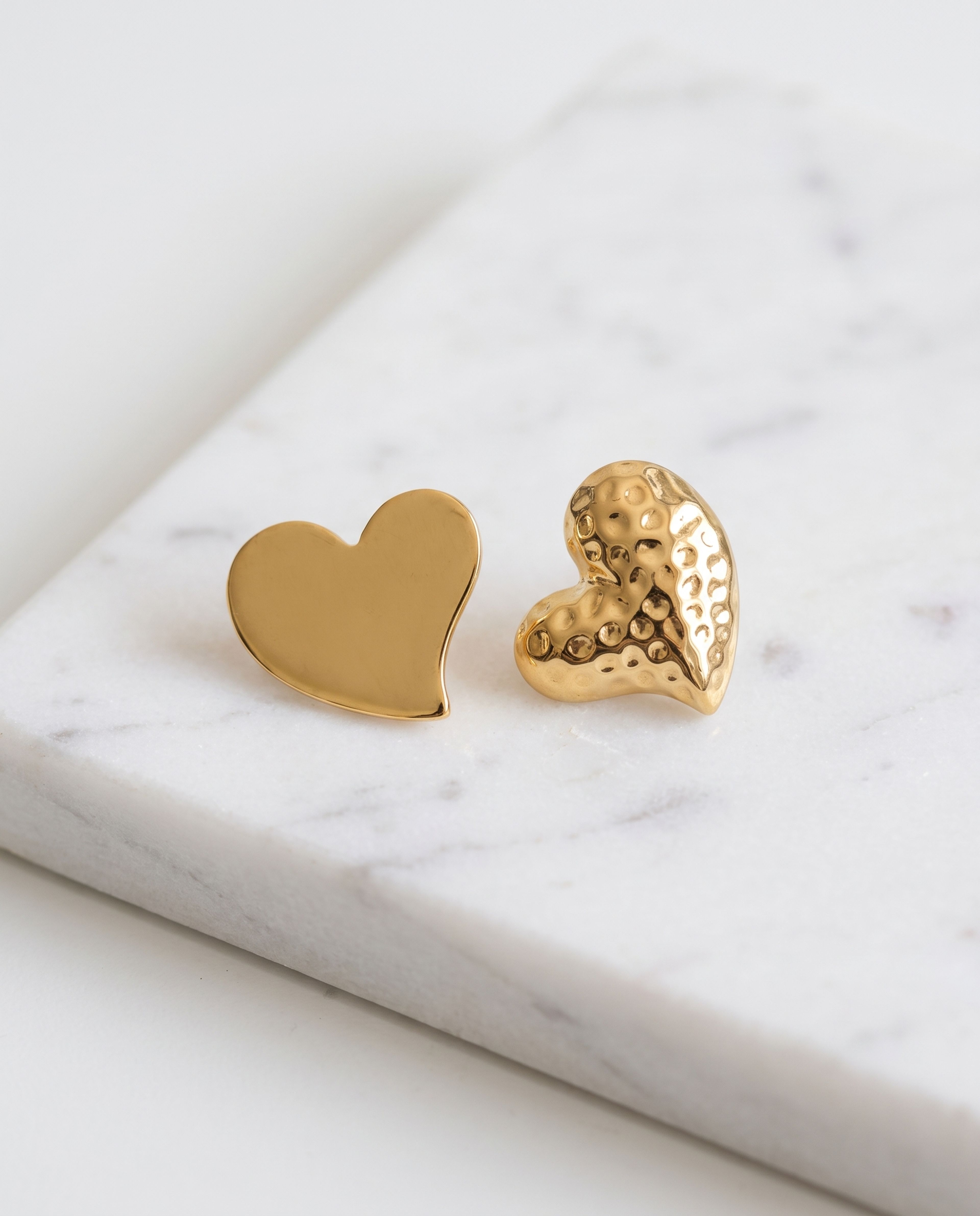 Heart Earring Anti Tarnish laid on white marble