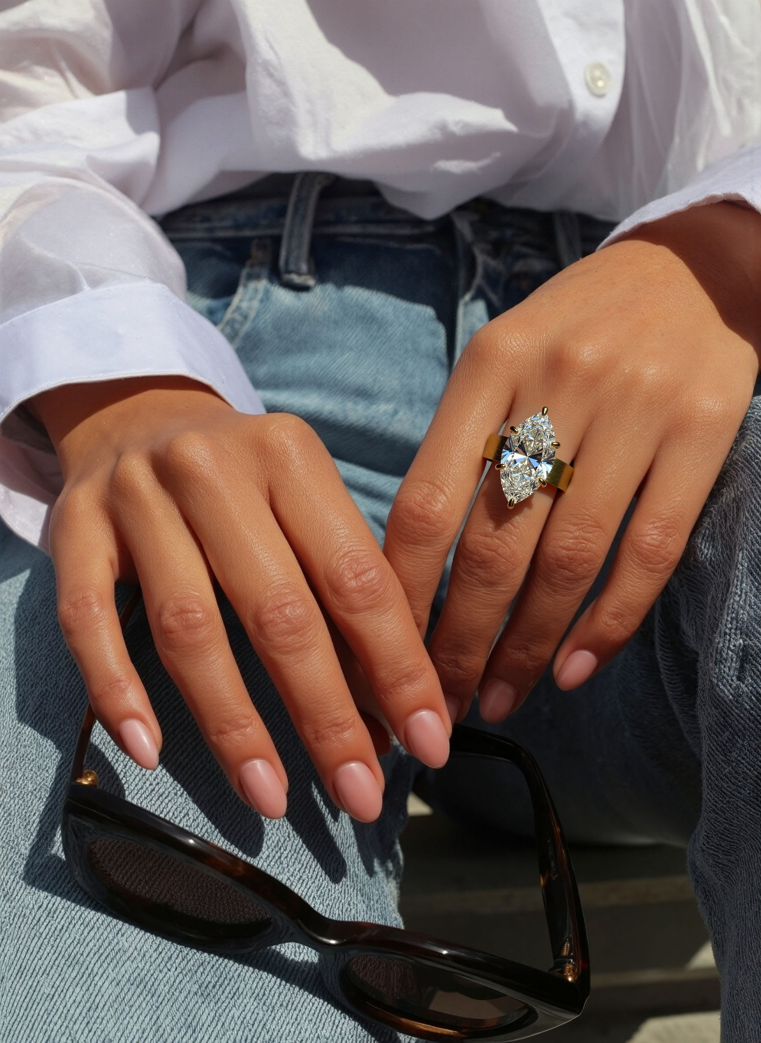 Photorealistic AI generated image of a woman's hand wearing a gold ring with a pear cut diamond, highlighting the diamond's sparkle and clarity, AI jewelry photography style.