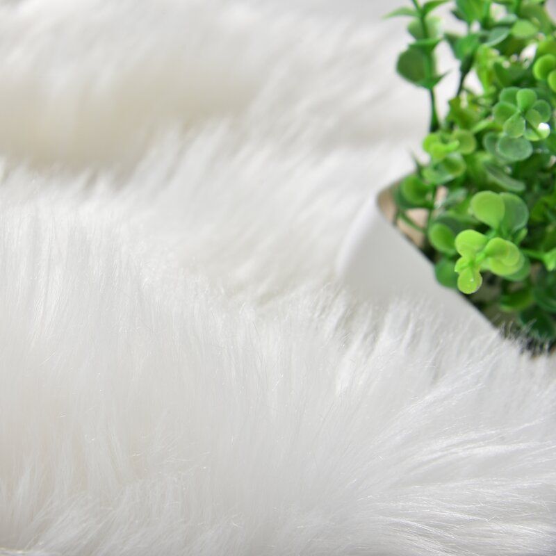 Kayzlynn Handmade Shag Faux Sheepskin White Area Rug-5'x8' thumbnail 2
