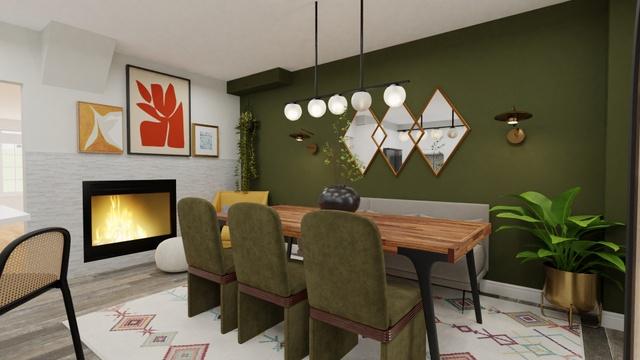 A mid-century dining room with an olive wall, olive velvet chairs, a wooden table and gold diamond mirrors