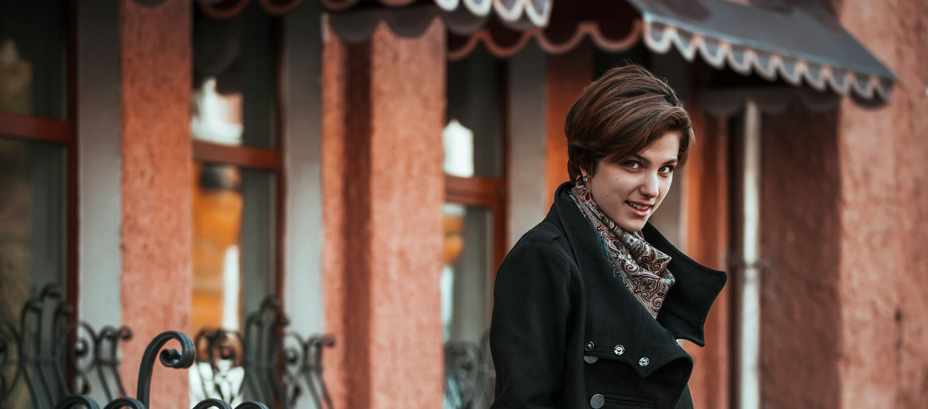 woman with a coat smiling