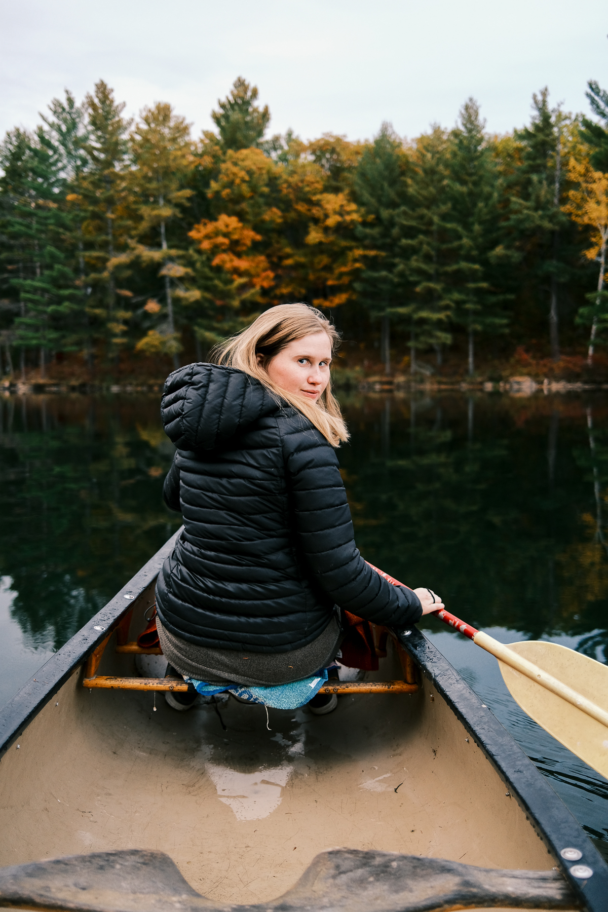 Nicola looking back sitting at the front of the canoe