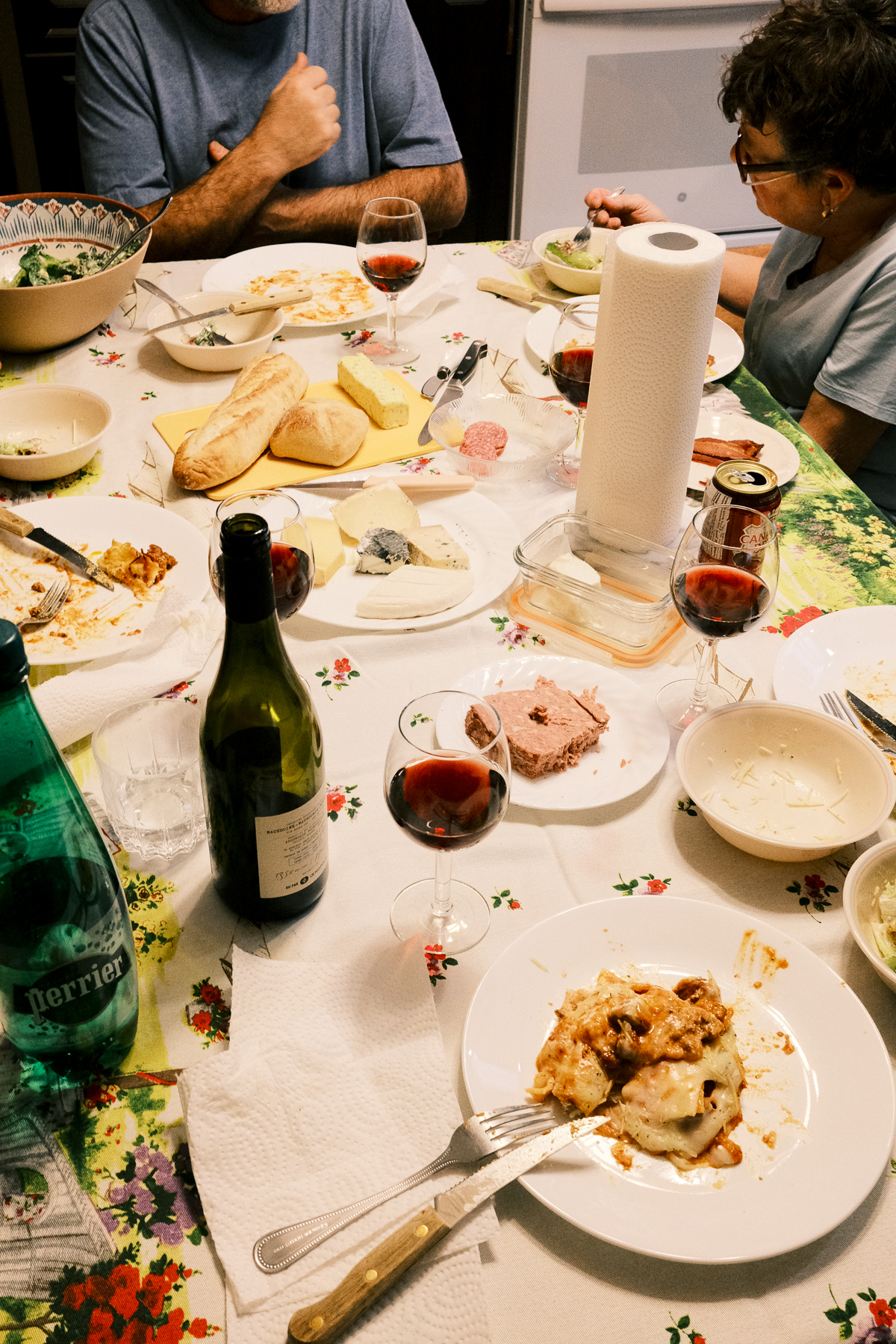 Dinner table covered in food