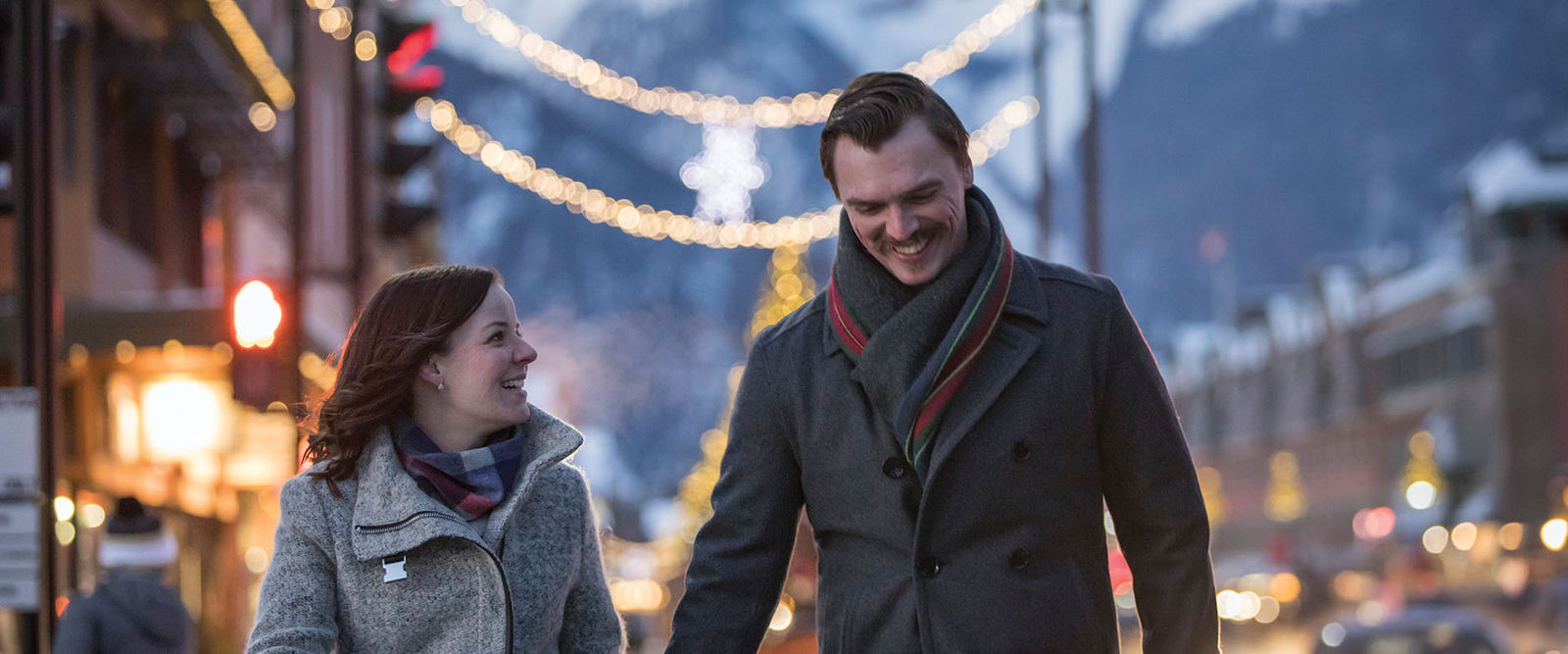 skibig3-blog-Christmas-in-Banff-banff-ave-walking-couple-christmas-lights