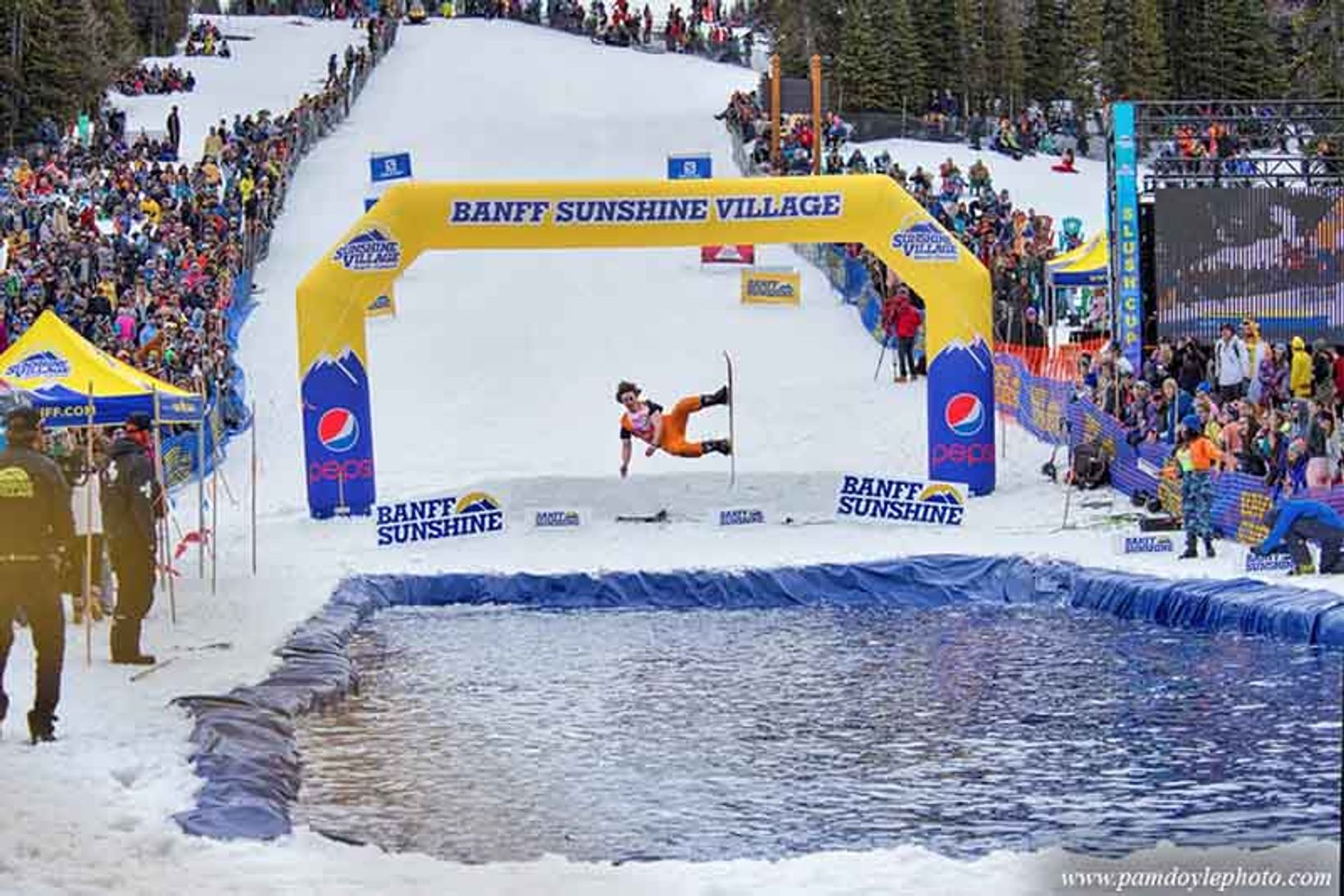 Skibig3 Blog Banff Sunshine Slush Cup Pon Skimming Snowboarder Orange Costume.jpg