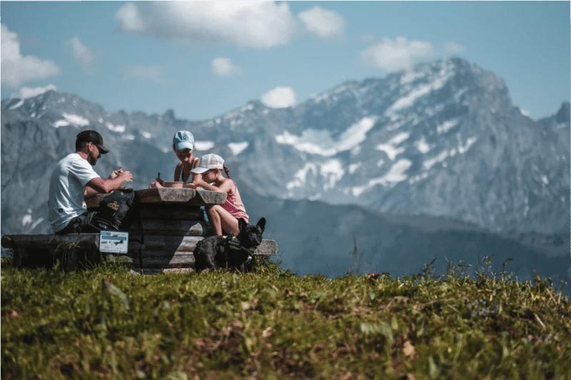CTA Hike A family eating a picnic at a table