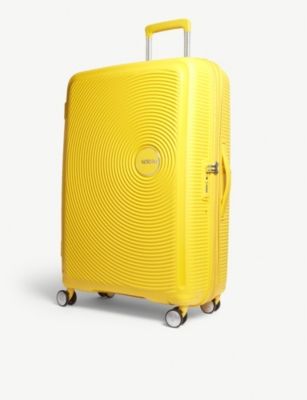 yellow american tourister